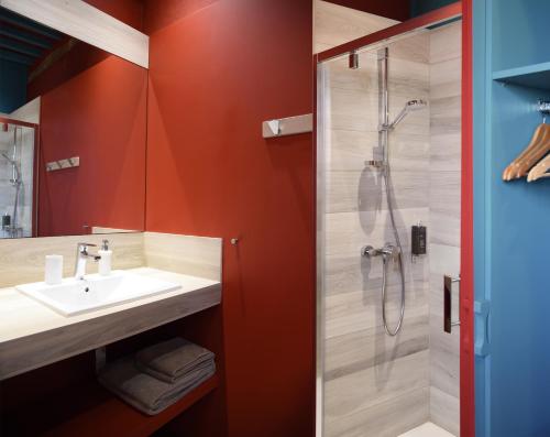 a bathroom with a sink and a shower at La Maison de Bazugues in Bazugues