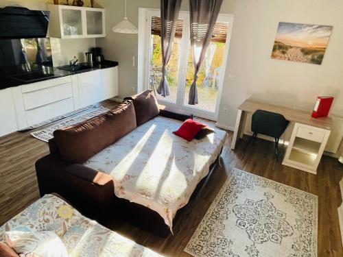 a living room with a couch and a table at Eine charmante Wohnung wartet auf Sie in Alzenau in Unterfranken