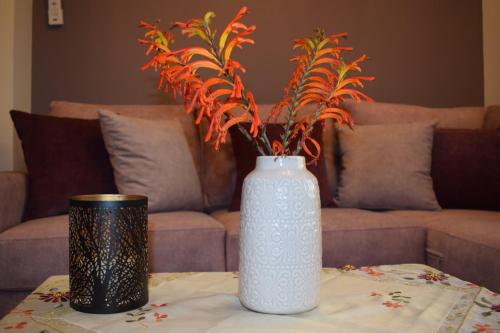 a white vase sitting on top of a table at Elsa's house in Kalymnos