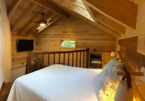 Llit o llits en una habitació de La Cabana del bosc