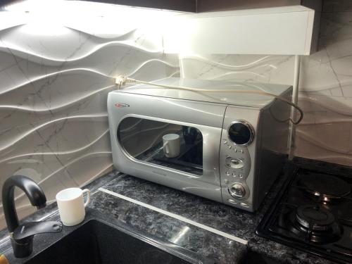 a toaster oven sitting on a counter in a kitchen at Ashtarak-1 Modern Apartment in Ashtarak