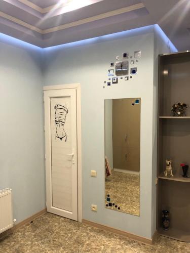 a room with a mirror and a painting on the wall at Ashtarak-1 Modern Apartment in Ashtarak