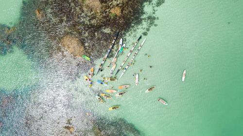 an aerial view of a group of boats in the water at Ipioca Beach Resort Maceió in Maceió