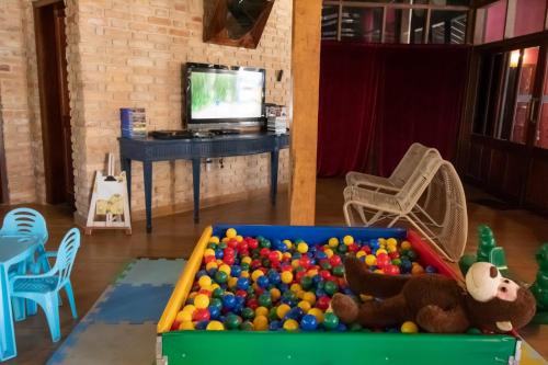 a large pool of balls in a room with a television at WINNER BEACH HOTEL in Juréia