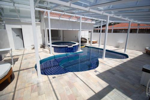 a large swimming pool in the middle of a building at WINNER BEACH HOTEL in Juréia