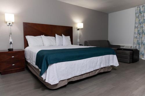 Ένα ή περισσότερα κρεβάτια σε δωμάτιο στο Studio 6 Ocala, FL