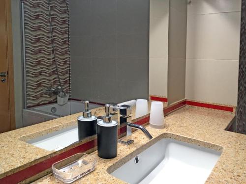 a bathroom with a sink and a shower at Sleep In Bucelas in Bucelas