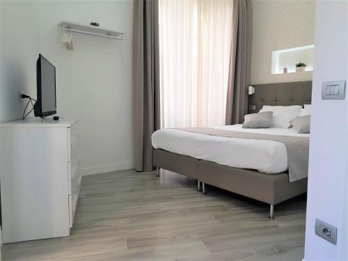 Letto o letti in una camera di Duomo Platinum Apartments