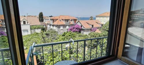 a view from a window of a building at Apartmani Neva Supetar in Supetar