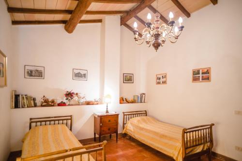 Un ou plusieurs lits dans un hébergement de l'établissement Agriturismo Collosodo