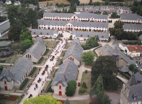 an aerial view of a large building with people standing outside at Chambres La Guignardais in Lamballe