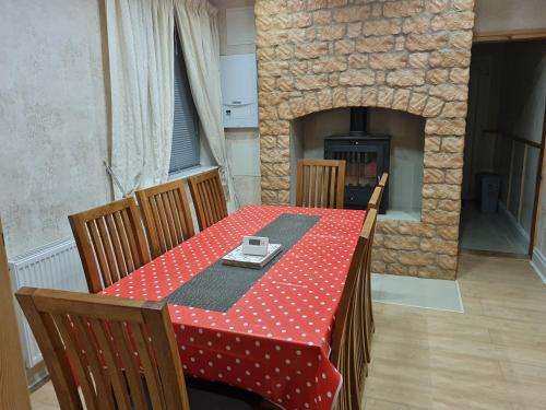 a table with a red and white polka dot table cloth at Cheerful 4-bedroom holiday home close to the Sea in Blackpool
