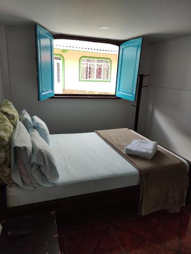 Cama ou camas em um quarto em Hosteria De Mi Pueblo