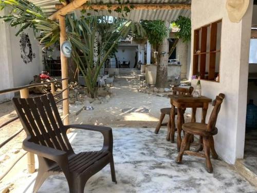 a patio with a table and chairs and a table and a table and chairs at Jumanji in Palomino