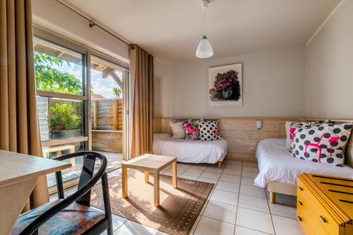 Postel nebo postele na pokoji v ubytování Logis Hôtel de L'Océan