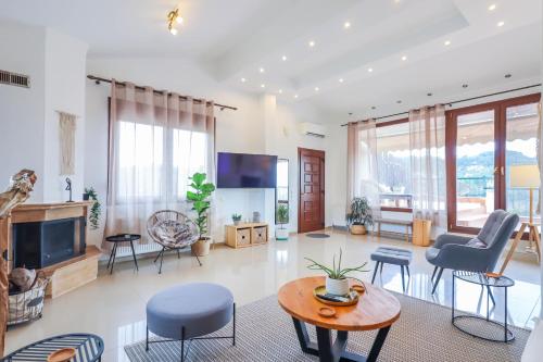 a living room filled with furniture and a tv at Villa Acropolis Serres Next to Center in Serres
