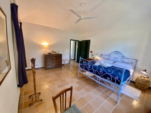 a bedroom with a blue bed in a room at La Fornace in Alessandria