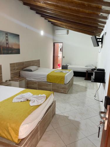 Katil atau katil-katil dalam bilik di Hotel Brisas MEDELLIN
