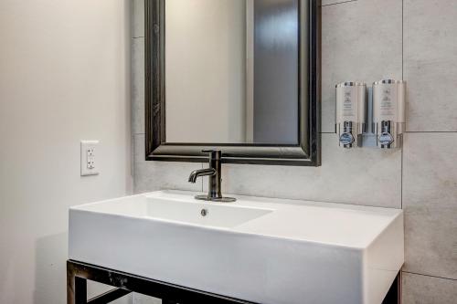 a bathroom with a white sink and a mirror at The Block Hotel & Commons in Silverthorne