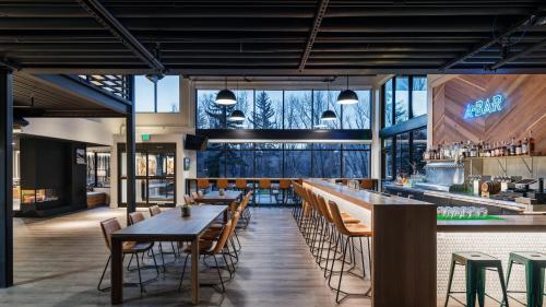 a restaurant with tables and chairs and a bar at The PAD in Silverthorne
