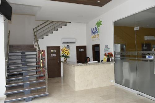a lobby with a staircase and a reception counter at Hotel Kai Soledad Atlántico in Soledad
