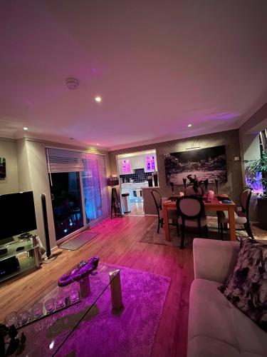 a living room with a couch and a table at Gleneagles Lettings in Auchterarder