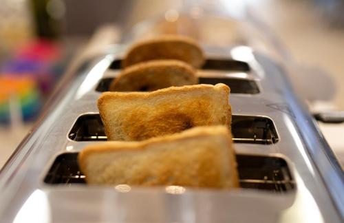 a group of breads on a tray in a bakery at Hotel Edelweiss Riccione in Riccione