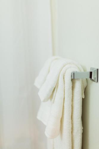 a towel hanging on a towel rack in a bathroom at Two Sunsets Hotel in Panguitch