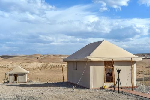 a tent in the middle of the desert at Agafay Pearl Camp Marrakech in Marrakech