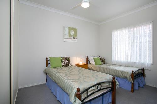 Postel nebo postele na pokoji v ubytování All Seasons Port Elliot Holiday House