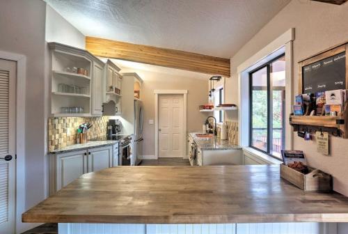 a large kitchen with a large wooden counter top at Beautiful Sedona Home Near Chapel of the Holy Cross in Sedona