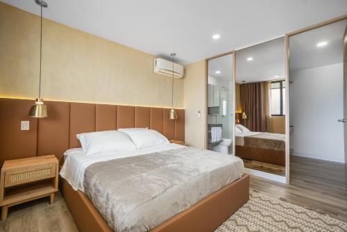 Ein Bett oder Betten in einem Zimmer der Unterkunft Apartamentos Go Living & Suites by HOUSY HOST
