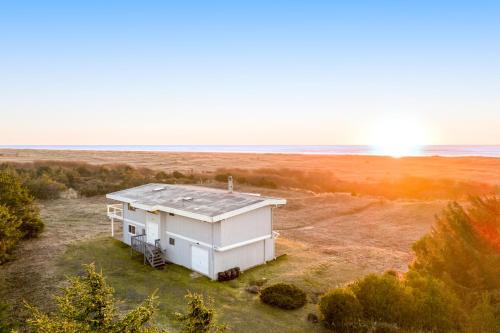 an aerial view of a small white building in a field at Copalis Beach Hideaway in Copalis Beach