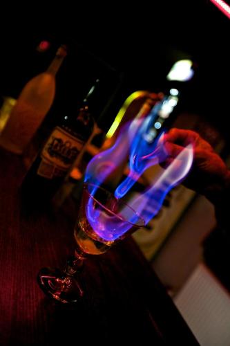 a glass with blue and purple lights on a table at Miro Mara Boutique Hotel & Lounge Bar in Edremit