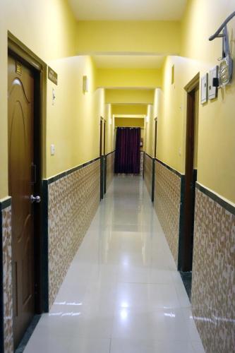 a hallway in a hospital with doors and a hallwayngth at THE HOTEL MILLENNIUM in Imphal