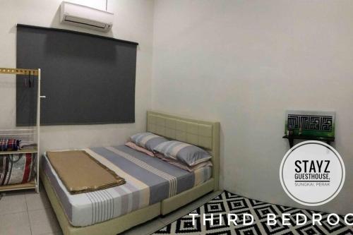 Postel nebo postele na pokoji v ubytování Stayz Guesthouse
