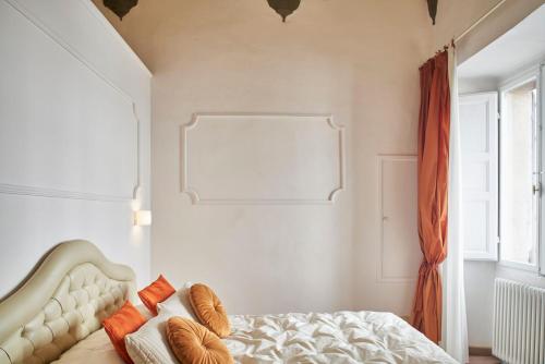 Кровать или кровати в номере Palazzo del Magnifico B&B