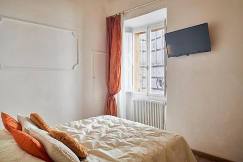 Телевизор и/или развлекательный центр в Palazzo del Magnifico B&B