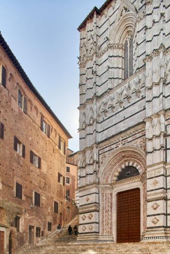 Фотография из галереи Palazzo del Magnifico B&B в Сиене