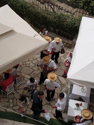 a group of people standing under a white tent at Casa di Martha in Corfu