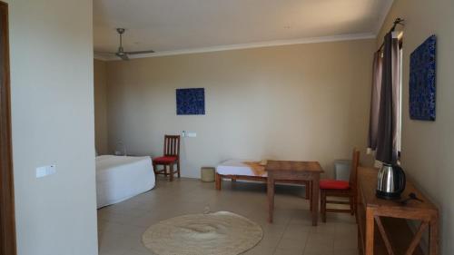 En eller flere senger på et rom på Coral House near Villa Bluu