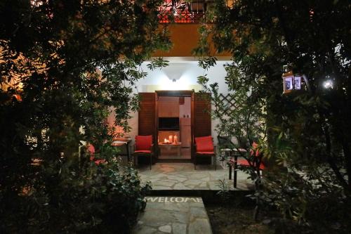 a living room with a fire in the fireplace at Koromilia Villa in Neo Klima