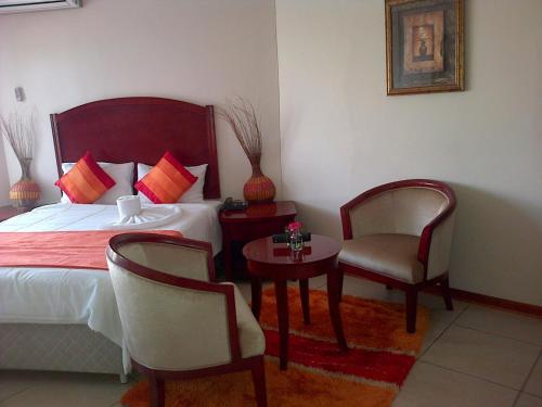 Postel nebo postele na pokoji v ubytování Comfort Palace Guesthouse
