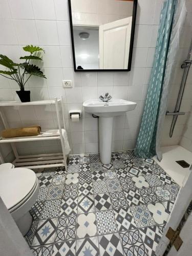 a bathroom with a sink and a toilet at Casa Mora in San Sebastián de la Gomera