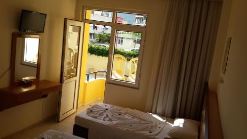Postel nebo postele na pokoji v ubytování Caner Hotel