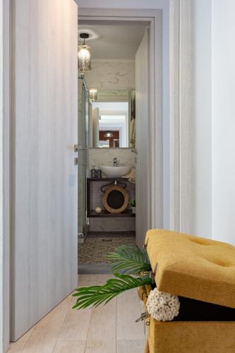 a bathroom with a sink and a toilet in a room at Villa Thalassa in Skaleta