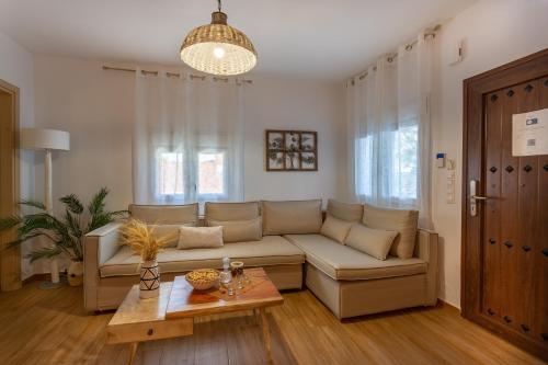 a living room with a couch and a table at Villa Thalassa in Skaleta