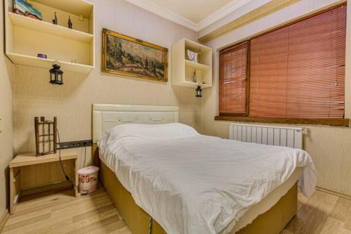 A bed or beds in a room at 34 Yüksel Caddesi