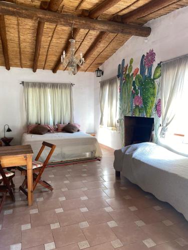 En eller flere senge i et værelse på Cactus y Almacen - Purmamarca