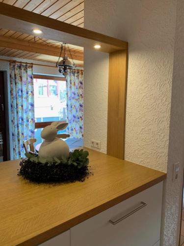 a kitchen counter with a toy rabbit on a island at Gästehaus Hartwig in Untergruppenbach